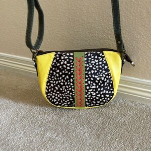 Upcycled leather cross body purse.